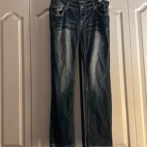Amethyst women’s boot cut jean. Has an inner thigh rip on both legs.
